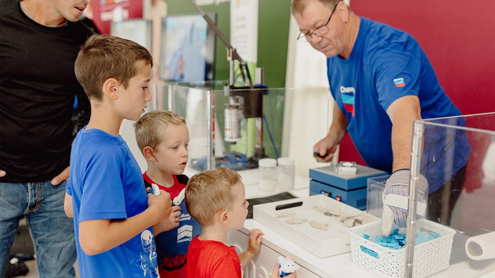 Chevron volunteer teaching future STEM students